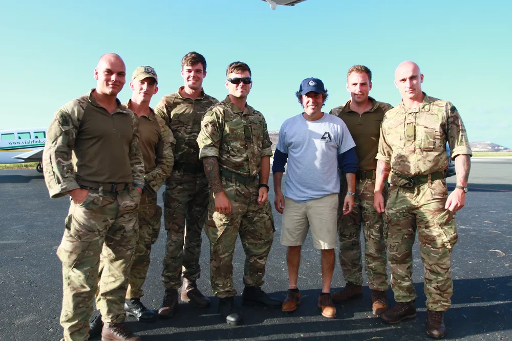 Spencer B. Haber with Royal Marines on the tarmac during the BVI rescue