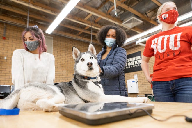 SUU engineering students working with Yeti in the lab
